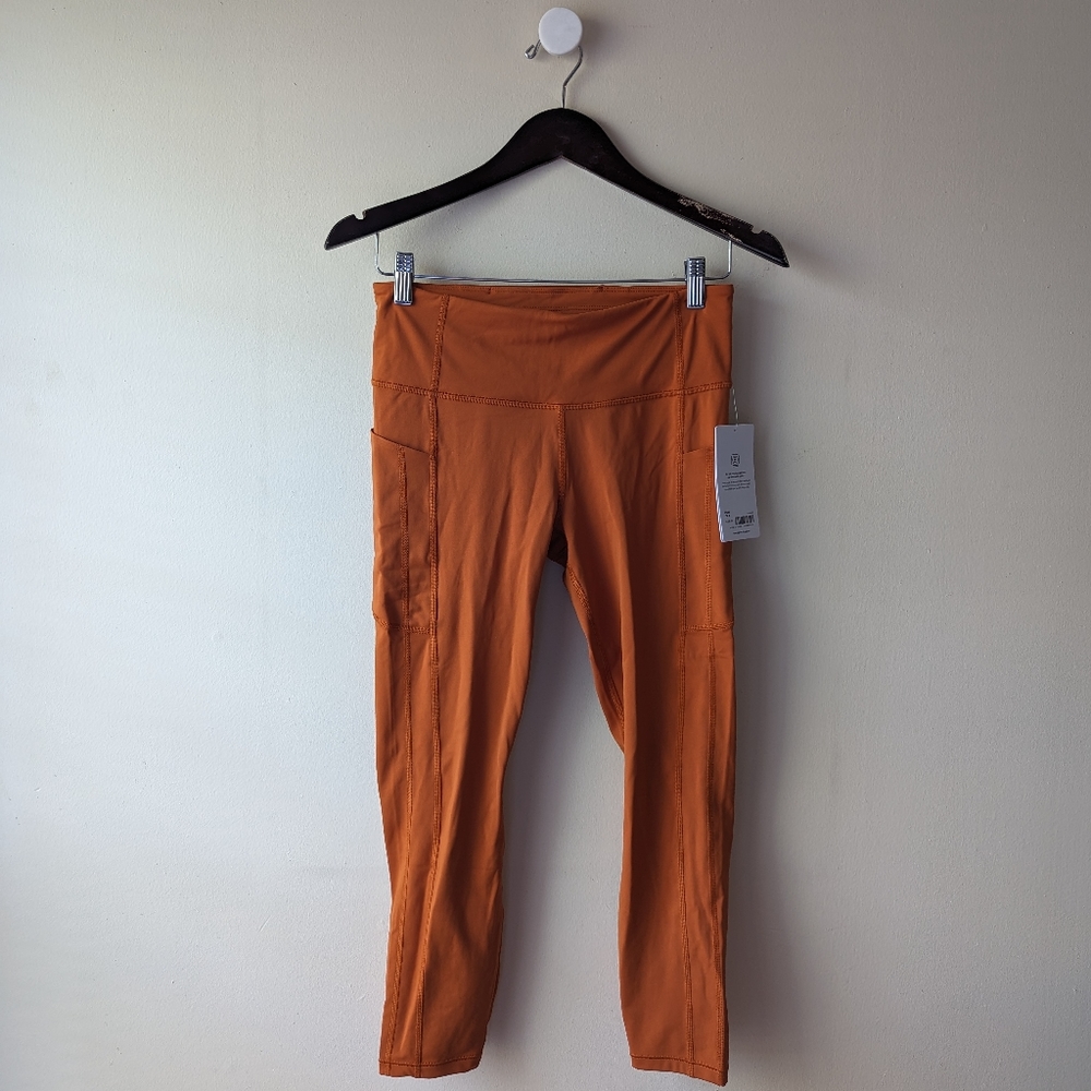 Athleta Ultimate Stash Tight 7/8 M Orange